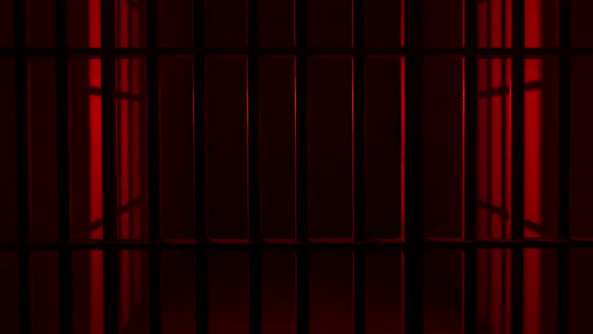 Prison Cell Bars Casting Shadows: Symbolizing Confinement and Loss of Freedom. metal prison cell bars casting shadows on the floor, representing themes of incarceration, confinement