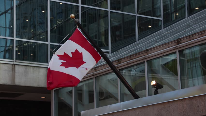Canadian flags on building in downtown district of Ottawa in Canada
