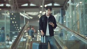 Happy asian man with backpack checking flight in phone on escalator in airport terminal, People concentrating typing digital device for travel in transportation, Concept of travel - Powered by Shutterstock - Get 15% off with code: PIKWIZARD15