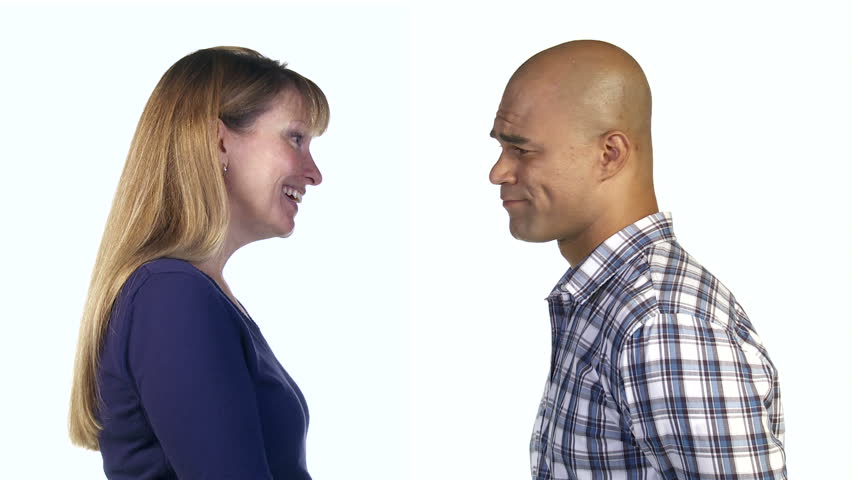 Woman uses positive gestures to try to persuade man, but he shakes his head and