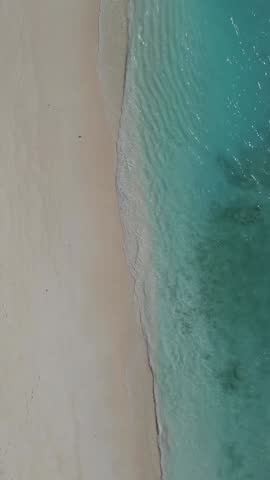 View from above at sandy beach and transparent water of Indian Ocean.Maldives