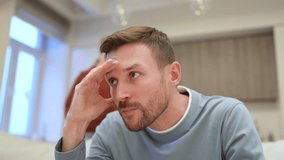 Couple conflict and argue. Irritated frustrated depressed man with head in hands listen to angry mad wife shouting in living room. Annoyed wife chastises and shouts at sad husband, couple quarrel - Powered by Shutterstock - Get 15% off with code: PIKWIZARD15