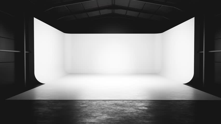 Professional photo studio setup with white cyclorama wall and dark interior