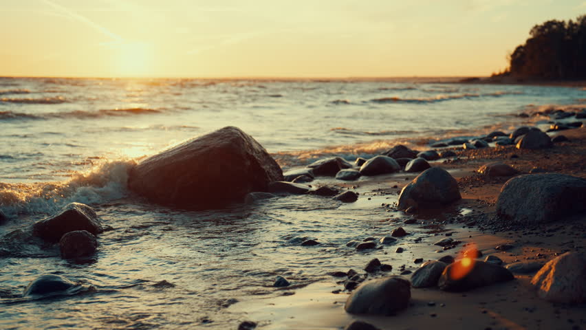 Beautiful seascape from shore in sunset or sunrise, waves washing coastline. Calmness and meditation on coast of ocean in summer vacation, contemplation beauty of nature, slow motion, enjoy solitude - Powered by Shutterstock - Get 15% off with code: PIKWIZARD15