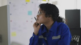  An Asian woman is analyzing code for robotic hands in a tech office, blending her programming skills with cutting-edge robotics and innovation. - Powered by Shutterstock - Get 15% off with code: PIKWIZARD15