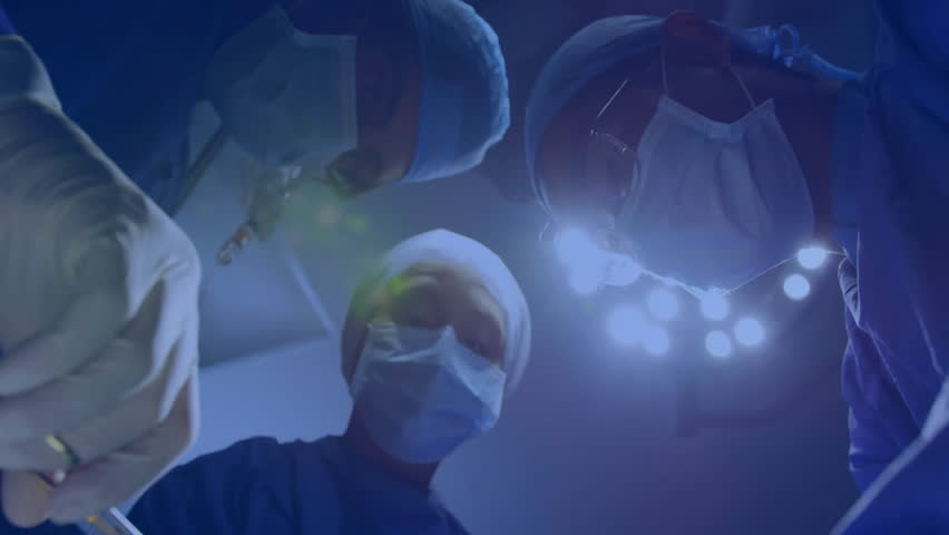 Performing surgery, medical team with data processing animation overlay in hospital. technology, healthcare, innovation, operation, teamwork, digital - Powered by Shutterstock - Get 15% off with code: PIKWIZARD15