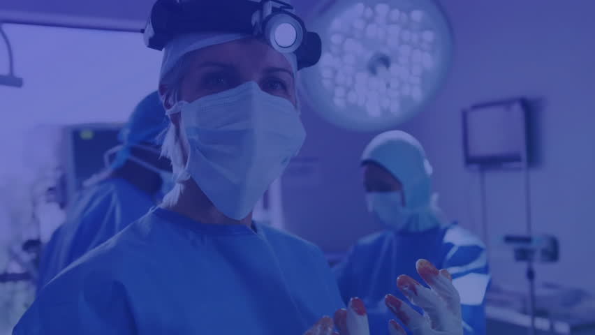 Analyzing digital data overlay, medical professionals in futuristic operating room animation. Healthcare, innovation, technology, surgery, advanced, analysis - Powered by Shutterstock - Get 15% off with code: PIKWIZARD15
