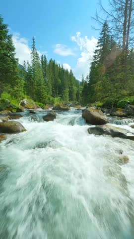 Flight over a mountain river. Shot on FPV drone. Tatra Mountains, Slovakia.