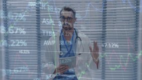 Analyzing financial data charts, doctor in medical office focusing on work. Finance, healthcare, analysis, professional, concentration, occupation - Powered by Shutterstock - Get 15% off with code: PIKWIZARD15