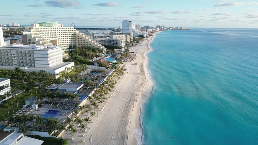 Stunning aerial view of a Cancun beach with hotels and turquoise water, playa delfines