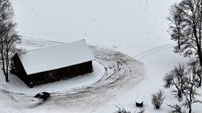 Spinning car leaving tracks in the snow, creating a drifting pattern in winter weather - Powered by Shutterstock - Get 15% off with code: PIKWIZARD15