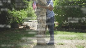 Hugging child, military person in garden surrounded by lush greenery. Family, reunion, affection, emotional, homecoming, nature - Powered by Shutterstock - Get 15% off with code: PIKWIZARD15