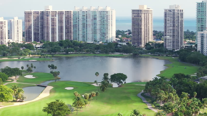 The aerial view showcases beautiful golf courses set among greenery and buildings in Florida, highlighting the areas charm as a perfect destination for relaxation and recreation