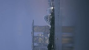 vertical video of Singapore skyline city at riverfront of singapore river with modern office highrise skyscraper financial buildings in central business district in sunset beautiful time. - Powered by Shutterstock - Get 15% off with code: PIKWIZARD15