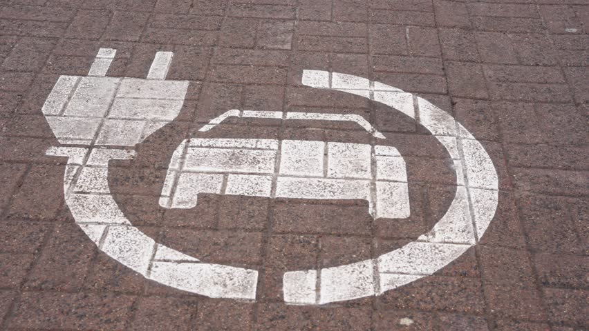 Electric vehicle charging station parking spot, plug symbol with car outline