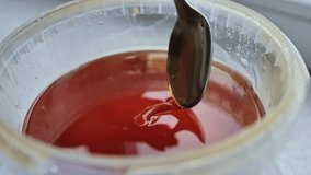 Slow-motion golden honey dripping smoothly from spoon, thick, rich consistency - Powered by Shutterstock - Get 15% off with code: PIKWIZARD15