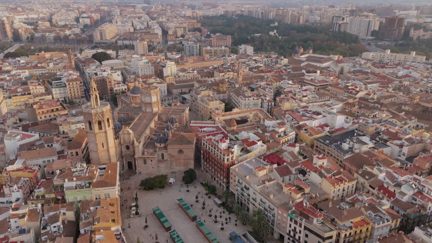 An aerial view beautifully reveals the stunning historic district of Valencia, showcasing the iconic Plaza de la Virgen, the magnificent Cathedral, and the impressive Palace of the Generalitat