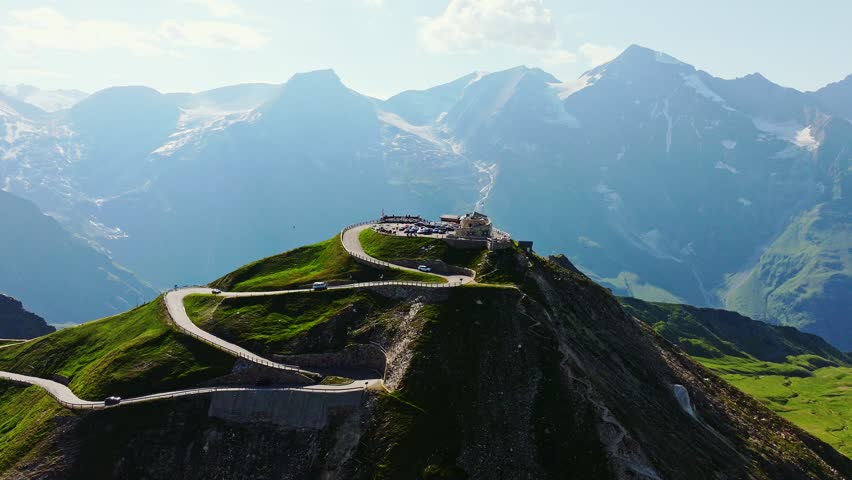 Cars ascend the highest point of Grossglockner High Alpine Road in slow motion