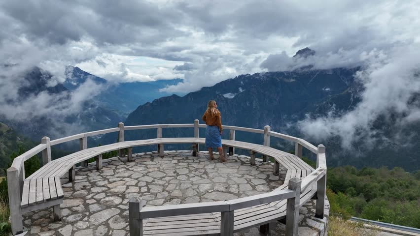 Woman Enjoys Scenic View from Viewpoint in Theth National Park AERIAL