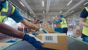 Workers in High-Visibility Vests Place a Package with a POV Camera Along a System of Conveyor Belts in a Distribution Hub. Camera Moving in Large-Scale Retail E-Commerce Logistics Service - Powered by Shutterstock - Get 15% off with code: PIKWIZARD15