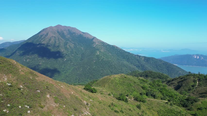 Lantau, Hong Kong: Aerial drone footage of the stunning Sunset peak in the Lantau island in Hong Kong SAR in China. 
