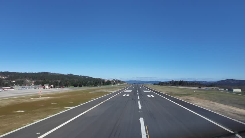 A pilot’s perspective in a real time landing at Vigo’s airport, in NW Spain, in a splendid sunny and unclouded day under a blue sky.