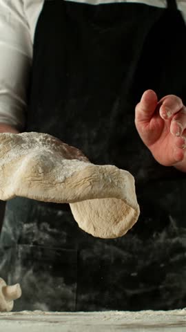 Super Slow Motion of Chef Making Yeast Dough . Filmed on High Speed Cinema Camera, 1000 fps . Closeup of Bread or Pizza Dough Preparation