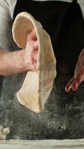 Super Slow Motion of Chef Making Yeast Dough . Filmed on High Speed Cinema Camera, 1000 fps . Closeup of Bread or Pizza Dough Preparation