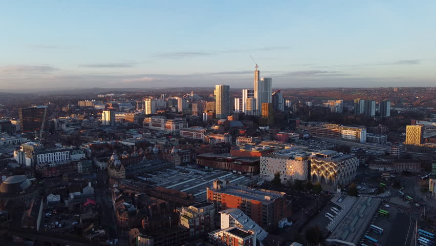 Leeds, England, City Skyline Aerial Reveal shot at Sunset