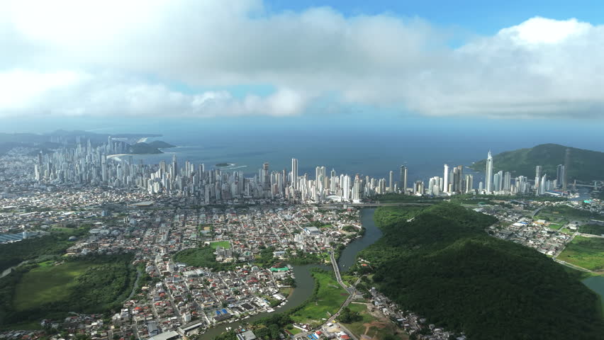 Wide drone view of tourist development in coastal area of ​​Santa Catarina, Brazil.