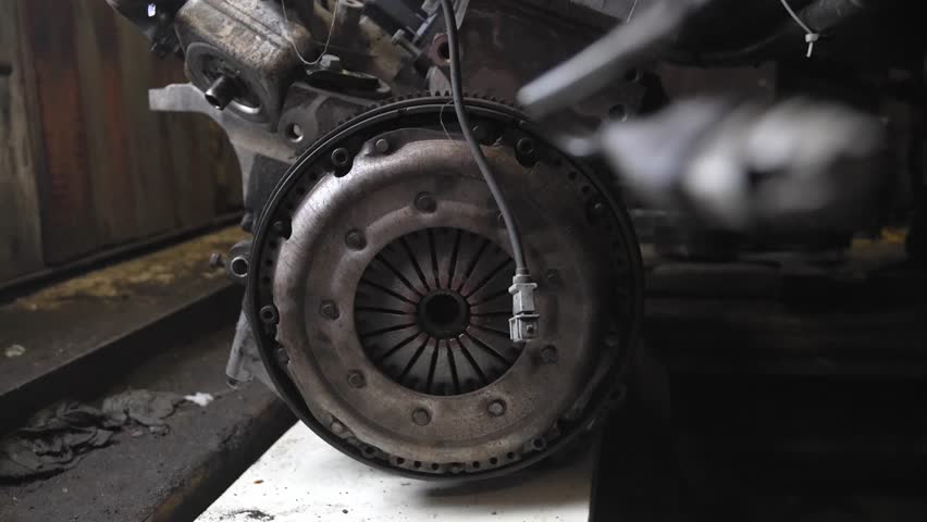 Used car's engine is ready to be installed, making sure that all components are properly connected and ready to power vehicle. It is in garage or service.