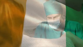 In operating room, surgeon performing surgery with animation of Ivory Coast flag. healthcare, operation, medical, procedure, teamwork, hospital - Powered by Shutterstock - Get 15% off with code: PIKWIZARD15