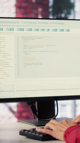 Vertical Video Freelancer typing commands into a futuristic AI chatbot to help solve tasks, artificial intelligence demonstrates the power of automation and virtual assistance for efficiency. Camera A