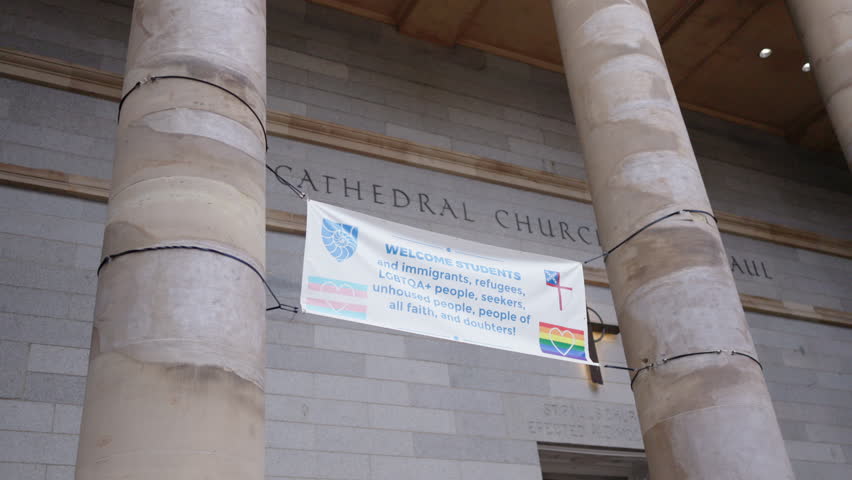 Experience the stunning Cathedral Church in downtown Boston, with impressive architecture and vibrant banners that enhance its charm, making it an architectural marvel attracting many visitors