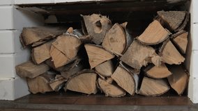 Chopped birch firewood in brick niche under fireplace - Powered by Shutterstock - Get 15% off with code: PIKWIZARD15