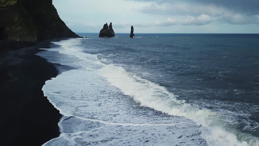 Black Sand Beach with Reynisdrangar Rocks in Iceland