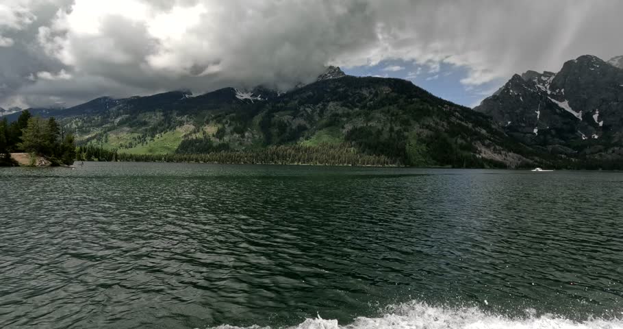 Tourist POV Enjoying A Scenic Boat Tour Speeding Across Jenny Lake In Grand Tetons National Park, USA.