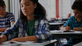 Student writing in classroom with financial data processing animation overlay. Education, learning, technology, finance, innovation, analysis - Powered by Shutterstock - Get 15% off with code: PIKWIZARD15