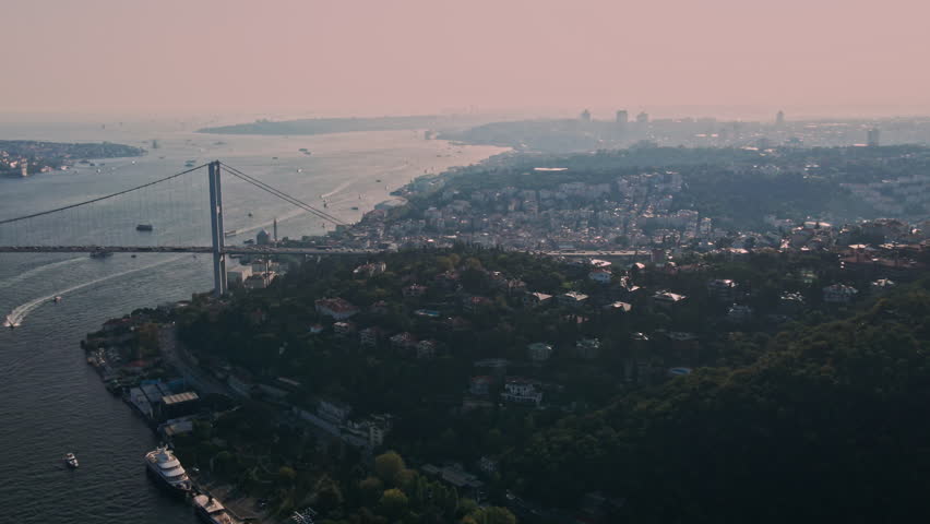 Aerial View of Fatih Sultan Mehmet Bridge with Ships and Sunset 4K