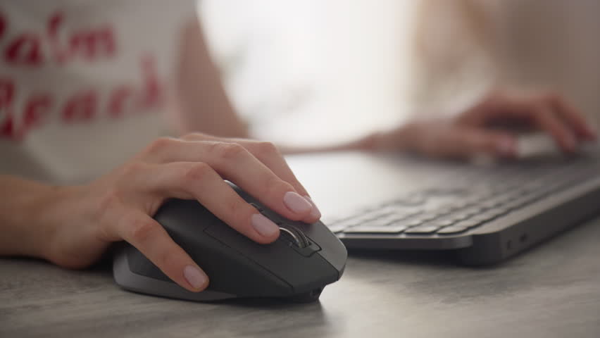 Close-up of hand using a computer mouse