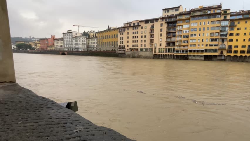 2025 Florence, Italy , ponte vecchio bridge , river flood . 4K resolution video . 