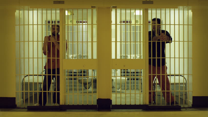 Two cells with bored prisoners doing time.