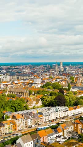 Vertical video. Ghent, Belgium. Panorama of the central city from the air. Cloudy weather, summer day, Aerial View. Rich colors