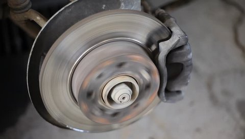 Closeup video of car disc brakes servicing