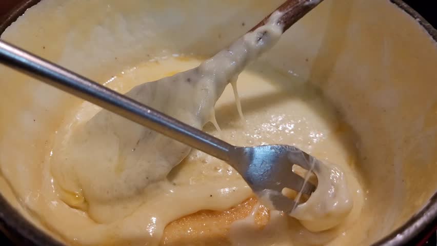 Piece of bread attached to a fork and which catches the cheese from a fondue savoyarde (or cheese fondue)