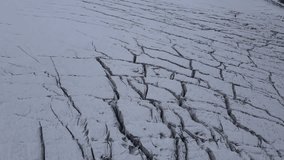 Snow-covered ice field with deep fissures on Elbrus mountain. A rugged and breathtaking alpine landscape in the Caucasus, shaped by extreme natural forces. - Powered by Shutterstock - Get 15% off with code: PIKWIZARD15