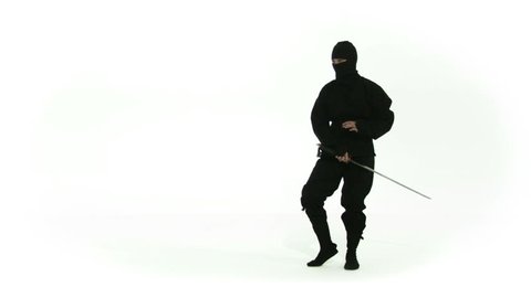 Ninja assassing posing with a sword on a white background. Recorded in slow motion at 60fps.
