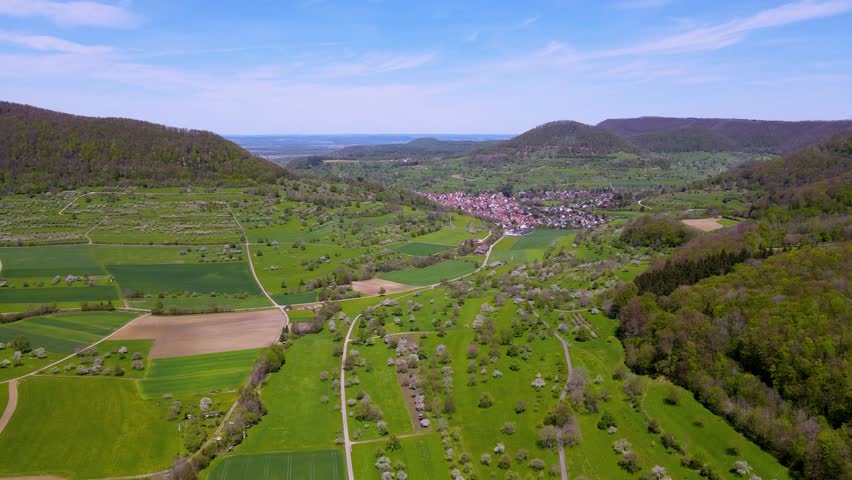 Aerial view of the canyion with the small village - Neidlingen on the Swabian alb. South Germany. Spring time.