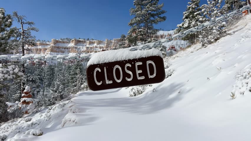 Stunning snowy landscape with closed sign Bryce Canyon National Park in winter, Utah, USA