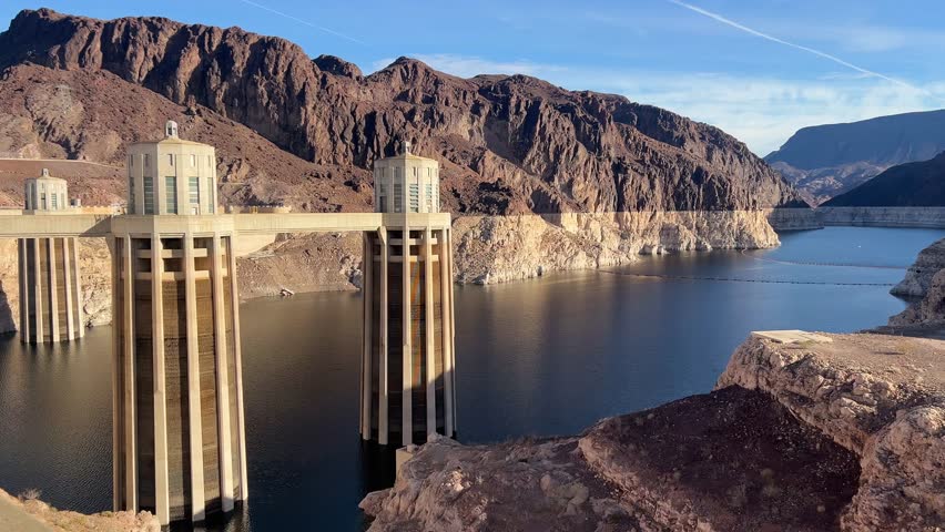 The famous Hoover Dam, nestled among rocky mountains and calm waters